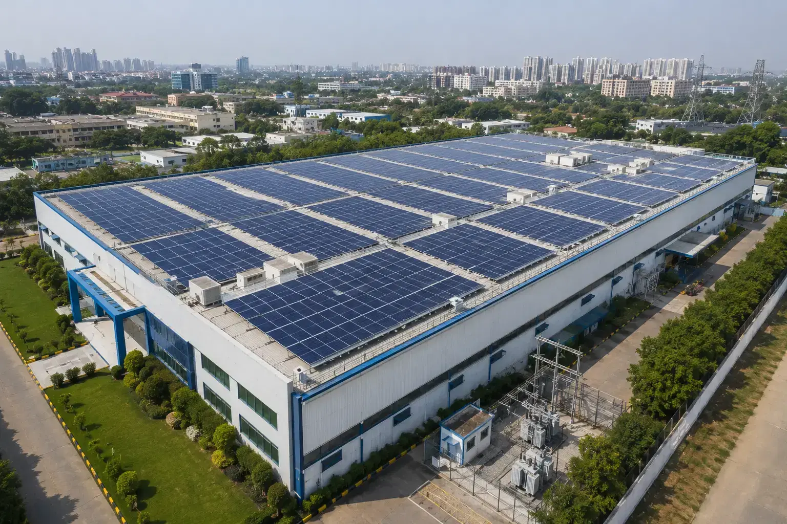 Rooftop solar array covering a commercial warehouse on the city outskirts